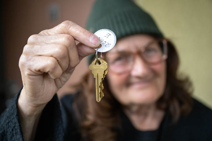 Mary Peña holds the keys to her permanent home in West Covina, April 13, 2023. A City-County collaboration, supported by the BOS-approved CCOGIHS fund, is helping residents of tiny villages move into permanent housing. (Photo/Michael Owen Baker)