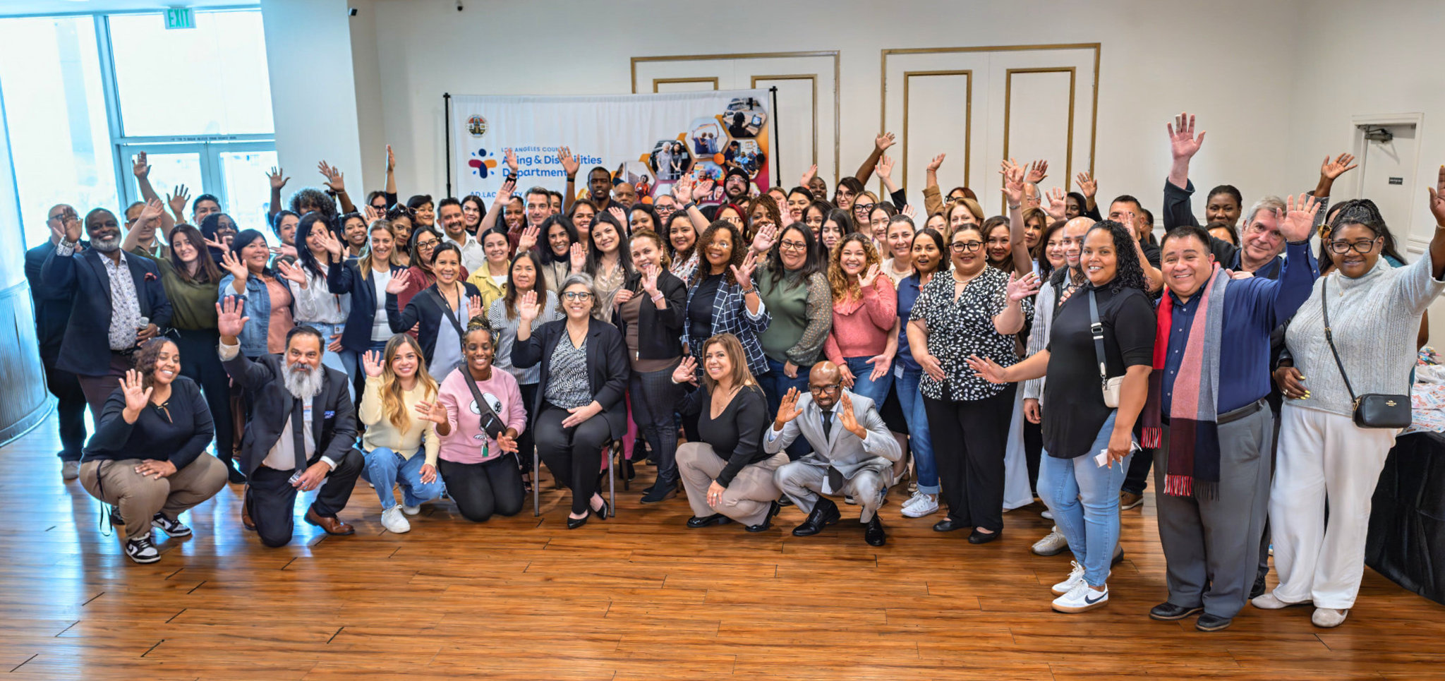 A group of APS Social Workers celebrating together and posing for a photo at the APS Appreciation Luncheon.